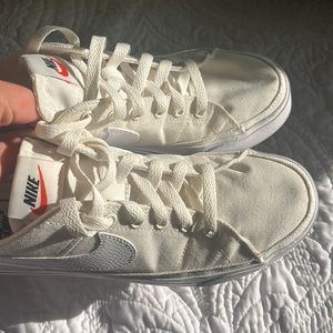 White Nike low tops
